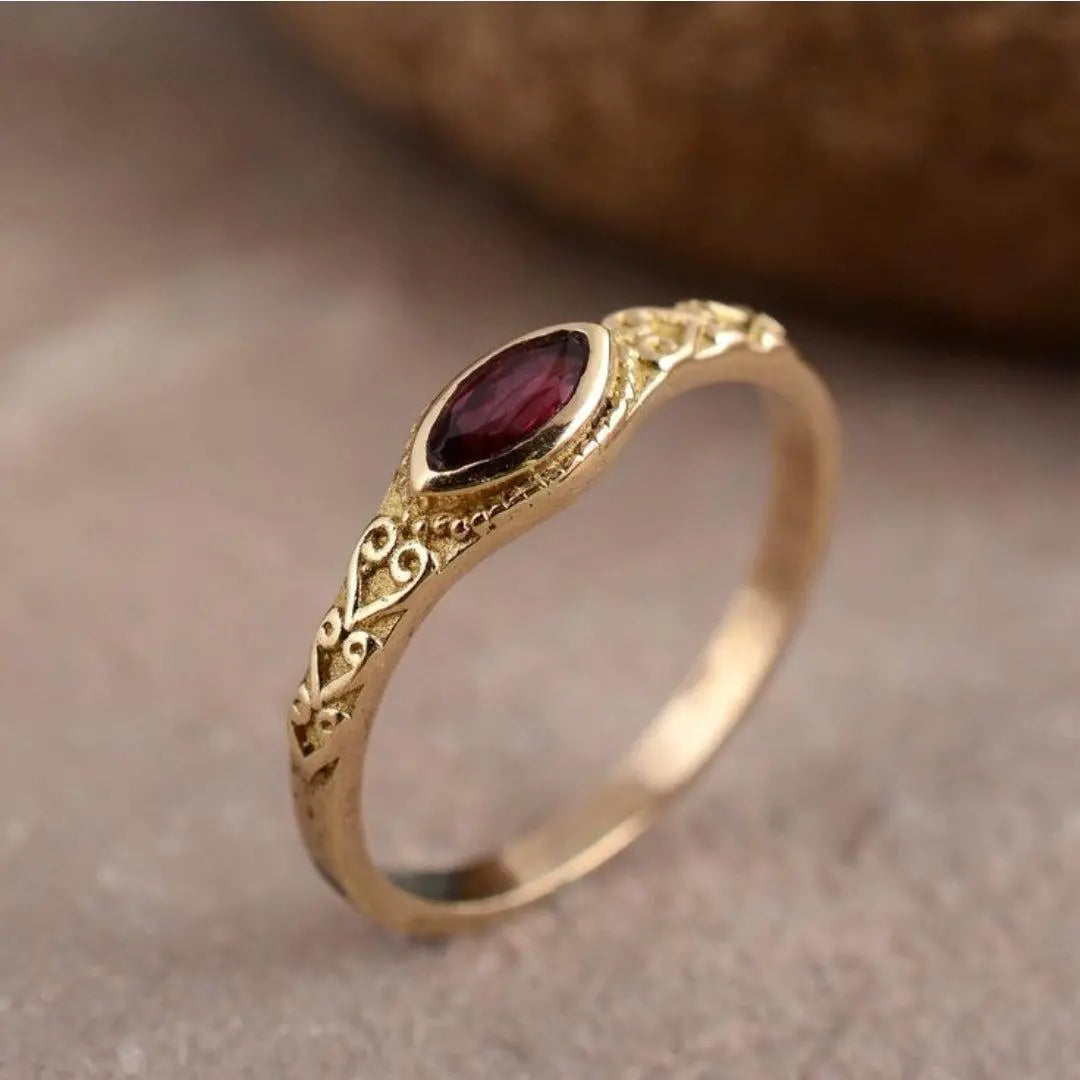 Vintage Gold-Tone Filigree Ring with Red Crystal-Style Center Stone