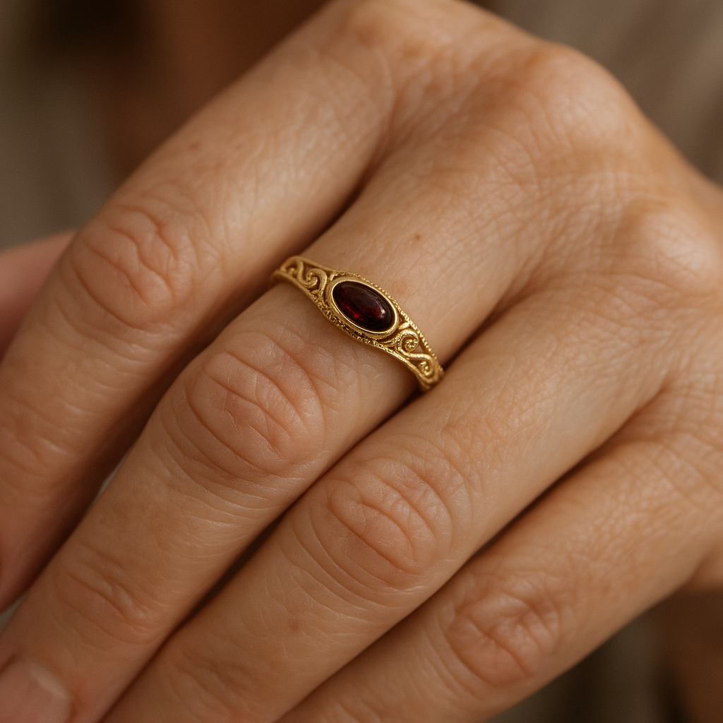 Vintage Gold-Tone Filigree Ring with Red Crystal-Style Center Stone